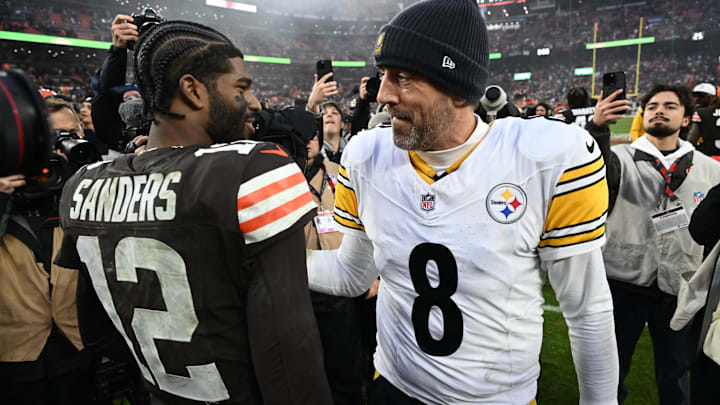 Dec 28, 2025; Cleveland, Ohio, USA; Pittsburgh Steelers quarterback Aaron Rodgers (8) and Cleveland Browns quarterback Shedeur Sanders (12) hug after the game at Huntington Bank Field. Mandatory Credit: Ken Blaze-Imagn Images