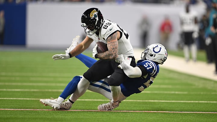 Jan 5, 2025; Indianapolis, Indiana, USA; Jacksonville Jaguars tight end Luke Farrell (89) is tackled by Indianapolis Colts linebacker Jaylon Carlies (57) during the first quarter at Lucas Oil Stadium. Mandatory Credit: Marc Lebryk-Imagn Images Jan 5, 2025; Indianapolis, Indiana, USA; Jacksonville Jaguars tight end Luke Farrell (89) is tackled by Indianapolis Colts linebacker Jaylon Carlies (57) during the first quarter at Lucas Oil Stadium. Mandatory Credit: Marc Lebryk-Imagn Images
