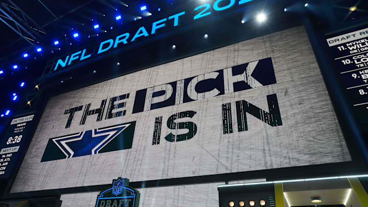The Dallas Cowboys logo is projected on the video board.