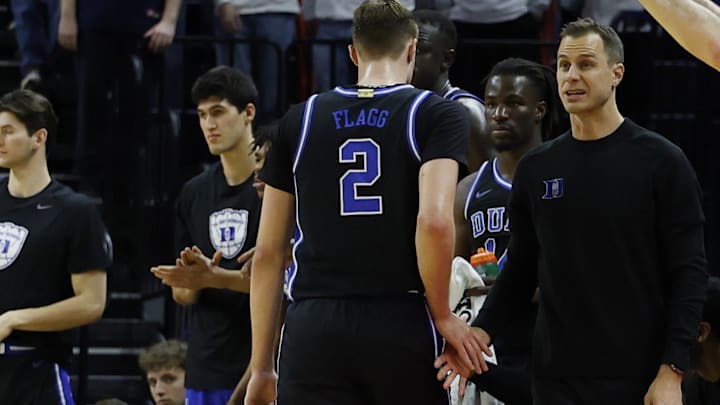 Duke basketball rookie forward Cooper Flagg and head coach Jon Scheyer Duke basketball rookie forward Cooper Flagg and head coach Jon Scheyer