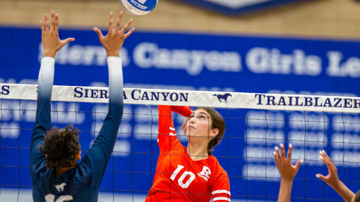Redondo Union sophomore Sienna Castillo goes up for kill against the block of Sierra Canyon senior Brandi Boston in Sept. 10 match won by Redondo 25-19, 25-21, 25-21, 25-18