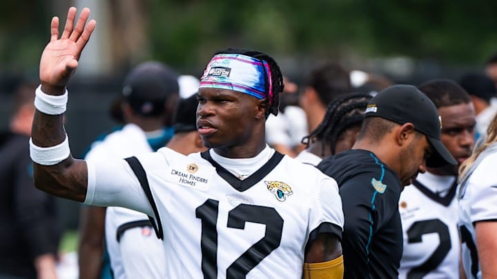 Jacksonville Jaguars wide receiver Travis Hunter (12) waves to someone in the stands after the Jacksonville Jaguars’ mandatory minicamp Tuesday June 10, 2025 at the Miller Electric Center in Jacksonville, Fla. [Doug Engle/Florida Times-Union]