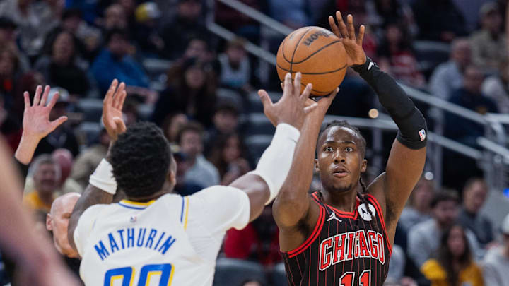 Nov 29, 2025; Indianapolis, Indiana, USA; Chicago Bulls guard Ayo Dosunmu (11) shoots the ball against Indiana Pacers guard Bennedict Mathurin (00) during the first half at Gainbridge Fieldhouse. Mandatory Credit: Trevor Ruszkowski-Imagn Images Nov 29, 2025; Indianapolis, Indiana, USA; Chicago Bulls guard Ayo Dosunmu (11) shoots the ball against Indiana Pacers guard Bennedict Mathurin (00) during the first half at Gainbridge Fieldhouse. Mandatory Credit: Trevor Ruszkowski-Imagn Images