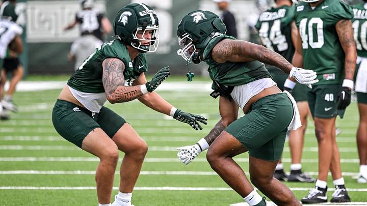 Michigan State linebackers Brady Pretzlaff, left, and Jordan Hall participate in a drill during football practice on Thursday, Aug. 6, 2026, in East Lansing. Michigan State linebackers Brady Pretzlaff, left, and Jordan Hall participate in a drill during football practice on Thursday, Aug. 6, 2026, in East Lansing.