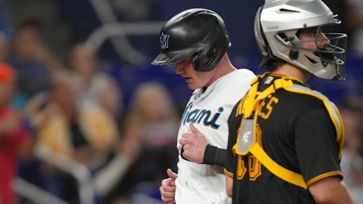 Jun 22, 2023; Miami, Florida, USA;  Miami Marlins first baseman Garrett Cooper (26) scores a run in