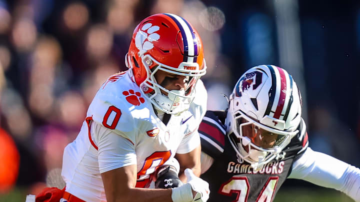 Nov 29, 2025; Columbia, South Carolina, USA; South Carolina Gamecocks defensive back Jalon Kilgore (24) breaks up a pass intended for Clemson Tigers wide receiver Antonio Williams (0) in the third quarter at Williams-Brice Stadium. Mandatory Credit: Jeff Blake-Imagn Images