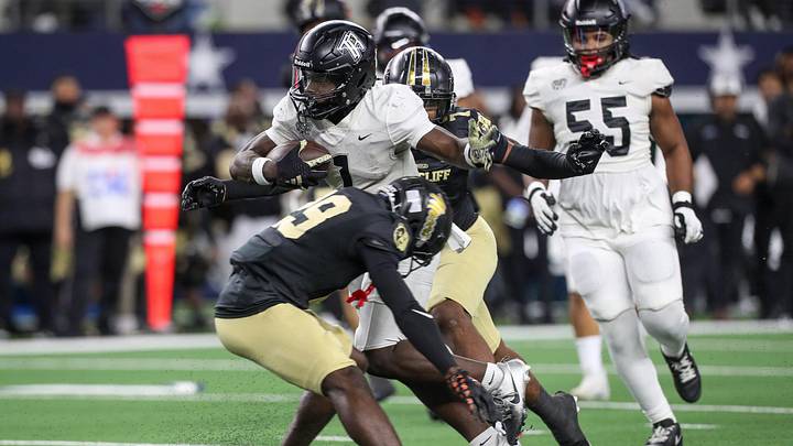 Richmond Randle's Landen Williams-Callis (1) breaks a tackle by South Oak Cliff's Rickey Giles (29) during the Class 5A, Division II State Championship game on Friday, Dec. 20, 2024, at AT&T Stadium in Arlington, Texas.