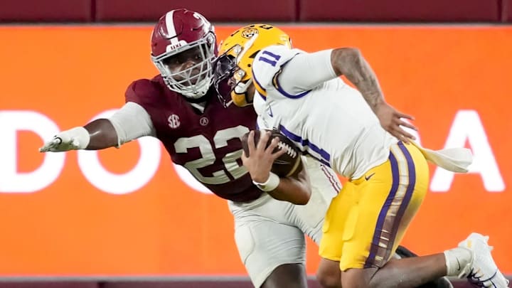 Nov 8, 2025; Tuscaloosa, Alabama, USA;  Alabama defensive lineman LT Overton (22) chases and sacks LSU quarterback Michael Van Buren Jr. (11) for a loss at Saban Field at Bryant-Denny Stadium. Alabama defeated LSU 20-9. Mandatory Credit: Gary Cosby Jr.-Imagn Images