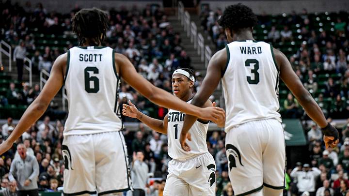 Michigan State's Jeremy Fears Jr., center, slaps hands with Jordan Scott, left, and Cam Ward, right, during the second half against Toledo on Tuesday, Dec. 16, 2025, at the Breslin Center in East Lansing. Michigan State's Jeremy Fears Jr., center, slaps hands with Jordan Scott, left, and Cam Ward, right, during the second half against Toledo on Tuesday, Dec. 16, 2025, at the Breslin Center in East Lansing.
