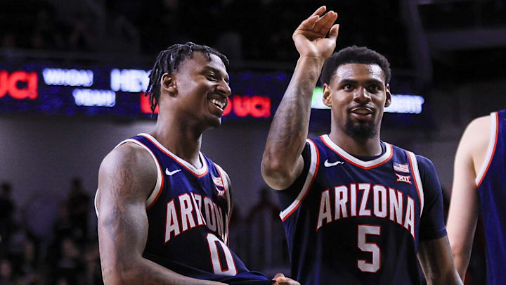 Arizona Wildcats guard KJ Lewis (5) and guard Jaden Bradley (0) react after the victory over the Cincinnati Bearcats at Fifth Third Arena. Arizona Wildcats guard KJ Lewis (5) and guard Jaden Bradley (0) react after the victory over the Cincinnati Bearcats at Fifth Third Arena.