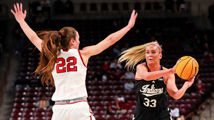Indiana Hoosiers guard Sydney Parrish (33) looks to pass around Utah Utes forward Jenna Johnson (22) in the first half at Colonial Life Arena.