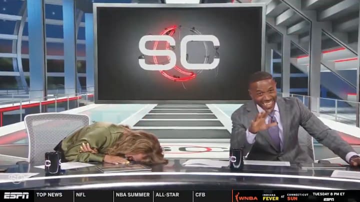 Nicole Briscoe and Ryan Smith lose it on SportsCenter. 