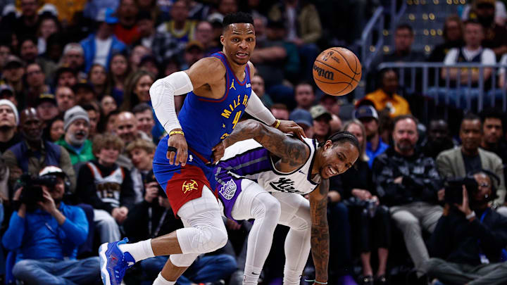 Mar 5, 2025; Denver, Colorado, USA; Denver Nuggets guard Russell Westbrook (4) strips the ball away from Sacramento Kings forward DeMar DeRozan (10) in the second quarter at Ball Arena. Mandatory Credit: Isaiah J. Downing-Imagn Images Mar 5, 2025; Denver, Colorado, USA; Denver Nuggets guard Russell Westbrook (4) strips the ball away from Sacramento Kings forward DeMar DeRozan (10) in the second quarter at Ball Arena. Mandatory Credit: Isaiah J. Downing-Imagn Images