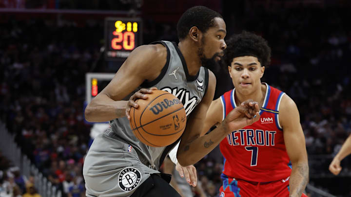 Dec 12, 2021; Detroit, Michigan, USA; Brooklyn Nets forward Kevin Durant (7) dribbles defended by Detroit Pistons guard Killian Hayes (7) in the first half at Little Caesars Arena. Mandatory Credit: Rick Osentoski-Imagn Images