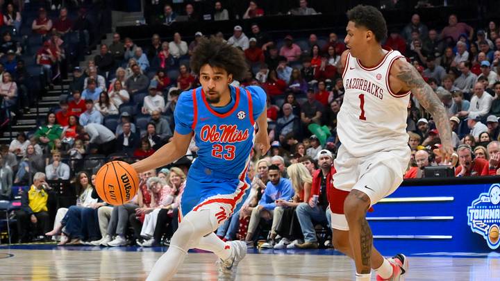 Mar 14, 2026; Nashville, TN, USA;  Mississippi Rebels guard Patton Pinkins (23) drives to the basket past Arkansas Razorbacks guard Meleek Thomas (1) during the second half at Bridgestone Arena. Mandatory Credit: Steve Roberts-Imagn Images