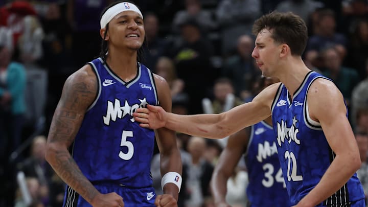 Nov 2, 2023; Salt Lake City, Utah, USA; Orlando Magic forward Paolo Banchero (5) reacts with forward Franz Wagner (22) after making a shot against the Utah Jazz in the fourth quarter at the Delta Center. 