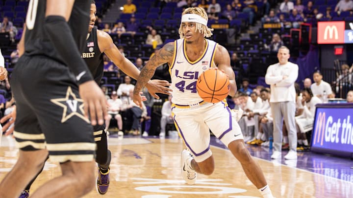 Feb 22, 2023; Baton Rouge, Louisiana, USA; LSU Tigers guard Adam Miller (44) dribbles against the Vanderbilt Commodores during the first half at Pete Maravich Assembly Center. Mandatory Credit: Stephen Lew-Imagn Images