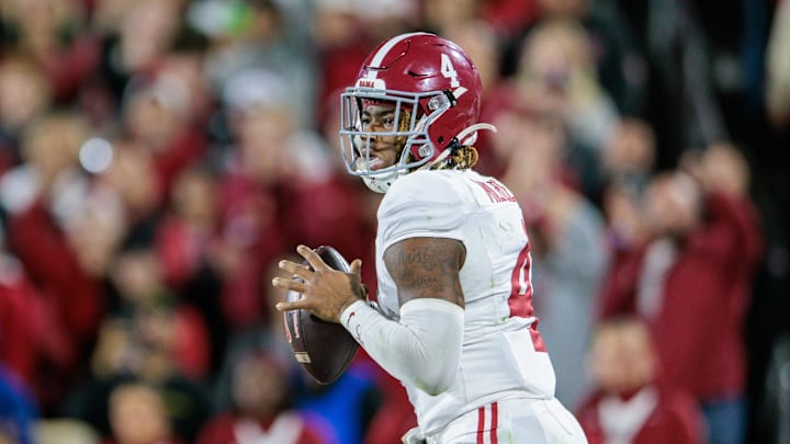 Nov 23, 2024; Norman, Oklahoma, USA; Alabama Crimson Tide quarterback Jalen Milroe (4) passes the ball during the fourth quarter against the Oklahoma Sooners at Gaylord Family-Oklahoma Memorial Stadium. Mandatory Credit: William Purnell-Imagn Images