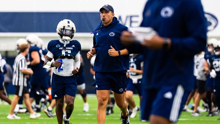 Penn State Nittany Lions football oach Matt Campbell jogs at the start of a practice session inside Holuba Hall. Penn State Nittany Lions football oach Matt Campbell jogs at the start of a practice session inside Holuba Hall.