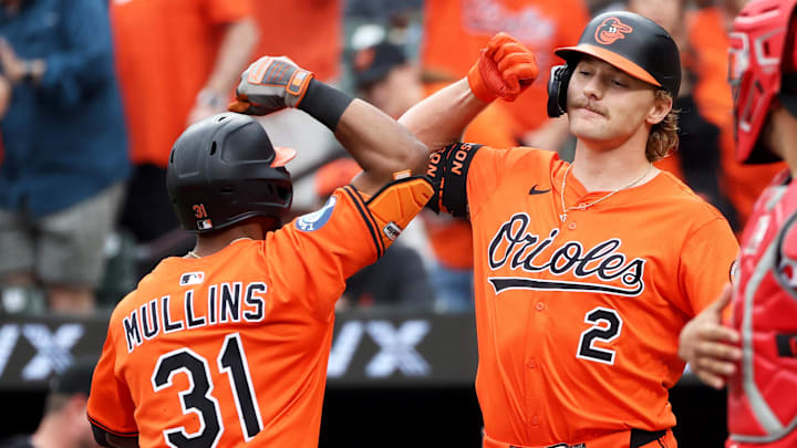Apr 19, 2025; Baltimore, Maryland, USA; Baltimore Orioles outfielder Cedric Mullins (31) celebrates with Baltimore Orioles shortstop Gunnar Henderson (2) after hitting a home run during the first inning against the Cincinnati Reds at Oriole Park at Camden Yards.