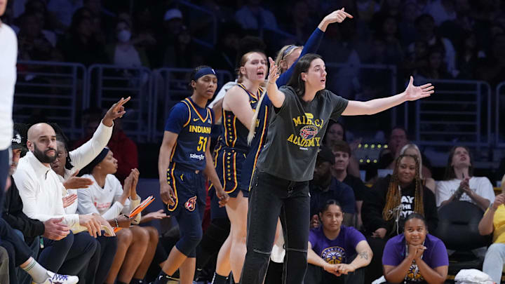 Aug 5, 2025; Los Angeles, California, USA; Indiana Fever guard Caitlin Clark (22) reacts from the bench in the second half against the LA Sparks at Crypto.com Arena. Mandatory Credit: Kirby Lee-Imagn Images