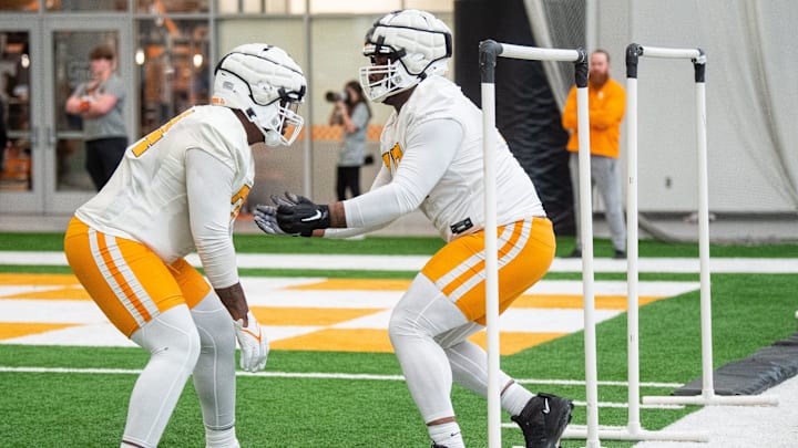 Tennessee offensive linemen John Campbell Jr. (74) and Larry Johnson III (77) during UT's first spring football practice on Monday, March 18, 2024.