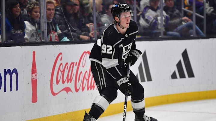 Feb 22, 2024; Los Angeles, California, USA; Los Angeles Kings defenseman Brandt Clarke (92) controls the puck against the Nashville Predators during the first period at Crypto.com Arena. Mandatory Credit: Gary A. Vasquez-Imagn Images