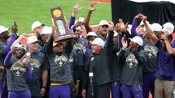 Louisiana State University athletes and their coach Dennis Shaver, center, celebrate after LSU captures the NCAA Outdoor Track and Field Championship in Eugene, Ore. June 11, 2021

Dennis Shaver