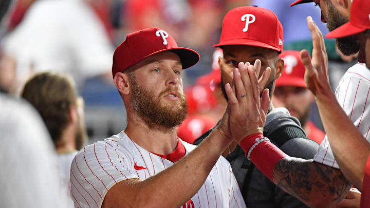 Jun 3, 2024; Philadelphia, Pennsylvania, USA;  Philadelphia Phillies pitcher Zack Wheeler (45) gets high fives in the dugout against the Milwaukee Brewers after pitching in the seventh inning at Citizens Bank Park