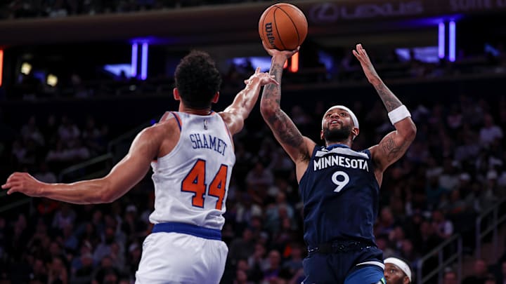 Oct 13, 2024; New York, New York, USA; Minnesota Timberwolves guard Nickeil Alexander-Walker (9) shoots the ball as New York Knicks guard Landry Shamet (44) defends during the second half at Madison Square Garden. Mandatory Credit: Vincent Carchietta-Imagn Images
