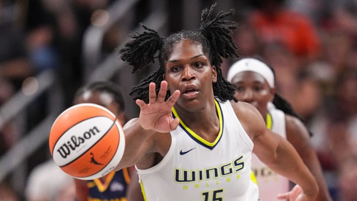 Dallas Wings center Teaira McCowan (15) reaches for the ball Sunday, Sept. 15, 2024, during the game at Gainbridge Fieldhouse in Indianapolis. The Indiana Fever defeated the Dallas Wings, 110-109.