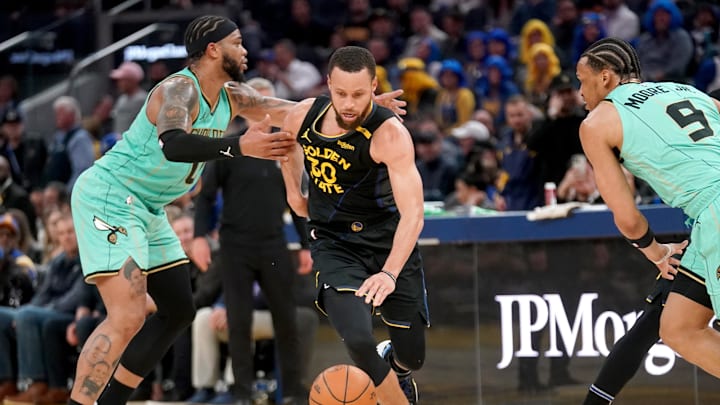 Feb 25, 2025; San Francisco, California, USA; Golden State Warriors guard Stephen Curry (30) is fouled by Charlotte Hornets forward Miles Bridges (0) in the second quarter at the Chase Center. Mandatory Credit: Cary Edmondson-Imagn Images