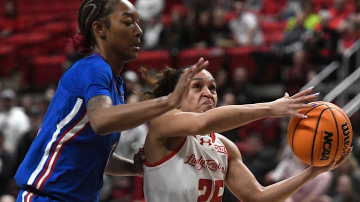 Texas Tech's guard Ashley Chevalier (25) prepares to go for a layup against Kansas in a Big 12 conference game