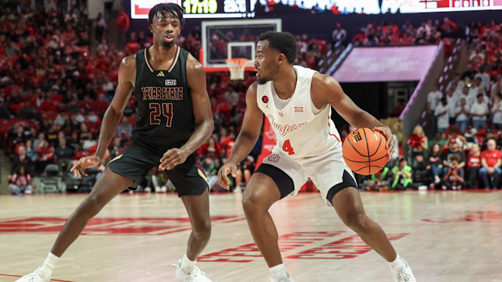Houston Cougars guard L.J. Cryer dribbles against Texas State Bobcats forward Brandon Love.