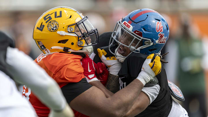 Jan 28, 2025; Mobile, AL, USA; American team offensive lineman Miles Frazier of LSU (70) spars with American team defensive lineman Walter Nolen of Ole Miss (2) during Senior Bowl practice for the American team at Hancock Whitney Stadium. Mandatory Credit: Vasha Hunt-Imagn Images