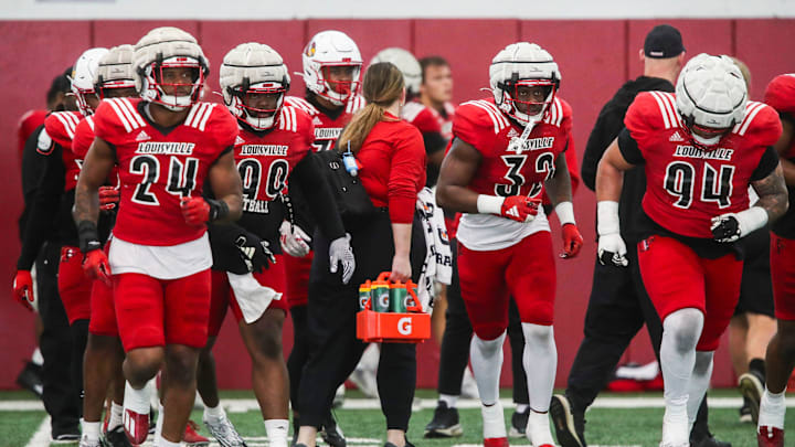The Louisville defense takes to the field during practice on April 12, 2024 before the Red-White scrimmage game. The Louisville defense takes to the field during practice on April 12, 2024 before the Red-White scrimmage game.