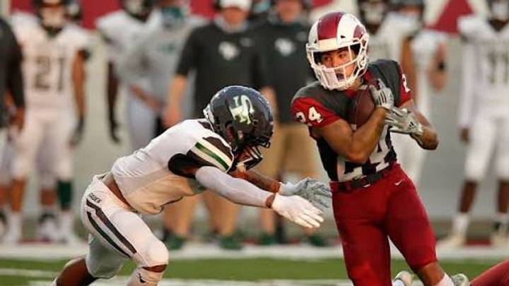 Owasso running back Jason Mojica carries the ball during a recent ballgame.