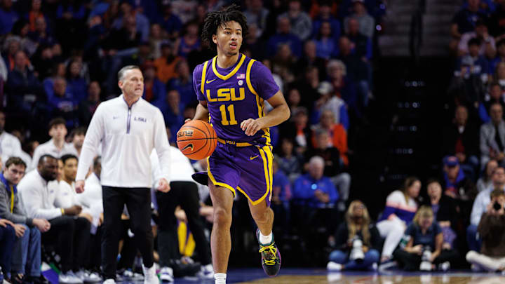 Jan 20, 2026; Gainesville, Florida, USA; Louisiana State Tigers guard Dedan Thomas Jr. (11) dribbles the ball against the Florida Gators during the first half at Exactech Arena at the Stephen C. O'Connell Center. Mandatory Credit: Matt Pendleton-Imagn Images