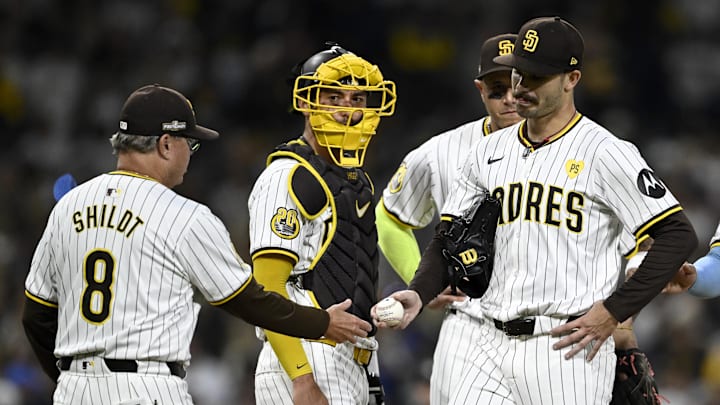Oct 9, 2024; San Diego, California, USA; San Diego Padres manager Mike Shildt (8) takes out pitcher Dylan Cease (84) in the second inning against the Los Angeles Dodgers during game four of the NLDS for the 2024 MLB Playoffs at Petco Park.  Mandatory Credit: Denis Poroy-Imagn Images