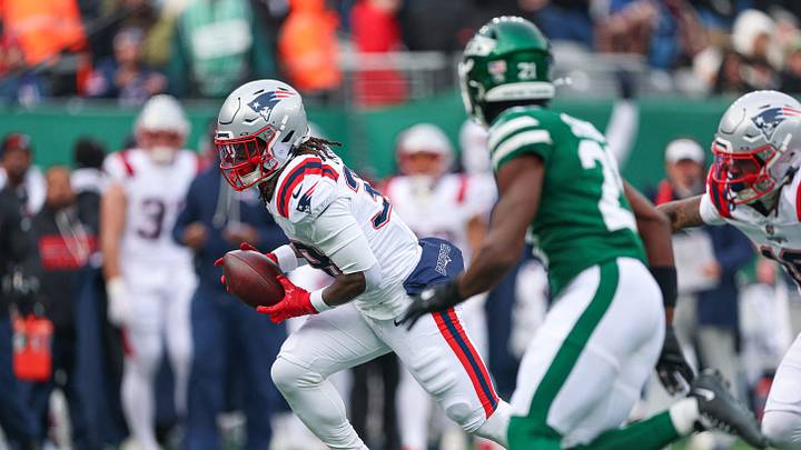 Dec 28, 2025; East Rutherford, New Jersey, USA; New England Patriots running back Rhamondre Stevenson (38) carries the ball during the first half against the New York Jets at MetLife Stadium. Mandatory Credit: Vincent Carchietta-Imagn Images Dec 28, 2025; East Rutherford, New Jersey, USA; New England Patriots running back Rhamondre Stevenson (38) carries the ball during the first half against the New York Jets at MetLife Stadium. Mandatory Credit: Vincent Carchietta-Imagn Images