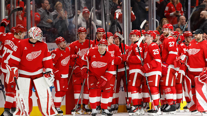 Jan 8, 2026; Detroit, Michigan, USA;  Detroit Red Wings right wing Patrick Kane (88) receives congratulations from teammates after he scores his 500 career goal in the third period against the Vancouver Canucks at Little Caesars Arena.