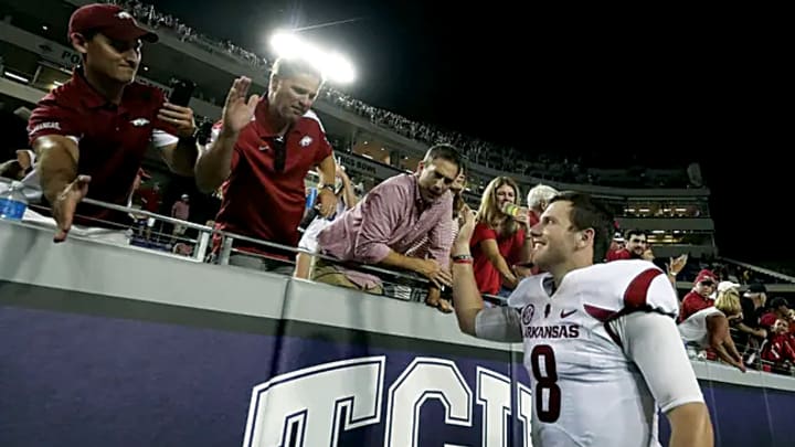 Arkansas Razorbacks quarterback Austin Allen (8) celebrates with fans after the game against the TCU Horned Frogs at Amon G. Carter Stadium. 