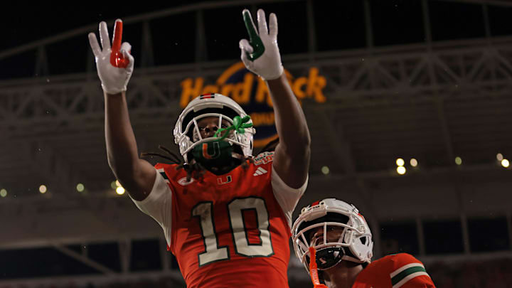 Aug 31, 2025; Miami Gardens, Florida, USA; Miami Hurricanes wide receiver Malachi Toney (10) reacts after scoring a touchdown against the Notre Dame Fighting Irish during the first quarter at Hard Rock Stadium. Mandatory Credit: Sam Navarro-Imagn Images