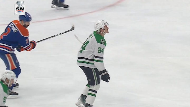 Edmonton Oilers defenseman Evan Bouchard slashes Dallas Stars forward Roope Hintz in Game 4.