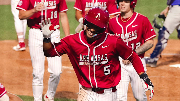 Arkansas third baseman TJ Pompey celebrates a home run against Central Arkansas at Baum-Walker Stadium.