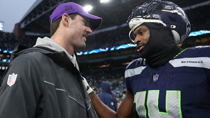 SEATTLE, WASHINGTON - DECEMBER 22: Daniel Jones #8 of the Minnesota Vikings and DK Metcalf #14 of the Seattle Seahawks speak following the game at Lumen Field on December 22, 2024 in Seattle, Washington. 