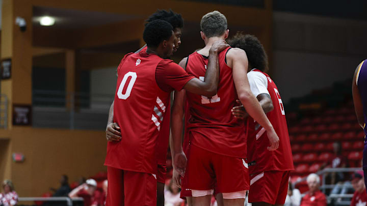 Indiana basketball guard Jasai Miles (0) huddles around forward Trent Sisley (11) during an exhibition game Aug. 6, 2025.