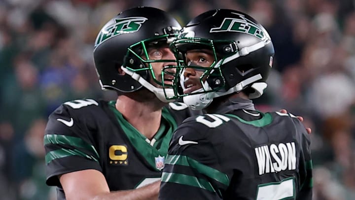 Oct 31, 2024; East Rutherford, New Jersey, USA; New York Jets quarterback Aaron Rodgers (8) and wide receiver Garrett Wilson (5) watch a video replay of their touchdown against the Houston Texans during the fourth quarter at MetLife Stadium. Oct 31, 2024; East Rutherford, New Jersey, USA; New York Jets quarterback Aaron Rodgers (8) and wide receiver Garrett Wilson (5) watch a video replay of their touchdown against the Houston Texans during the fourth quarter at MetLife Stadium.