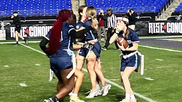 Clarksburg's Ella Geary (right) reacts with complete surprise after making the first touchdown reception of her girls high school flag football career. It happened at M&T Bank Stadium and sealed the Coyotes victory in the championship game of the Maryland state flag football tournament hosted by the Baltimore Ravens.