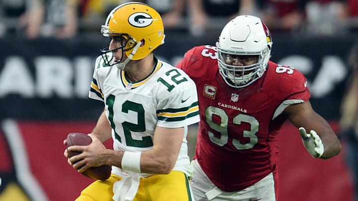 Arizona Cardinals defensive end Calais Campbell (93) pursues Green Bay Packers quarterback Aaron Rodgers (12) during the first half at University of Phoenix Stadium in a 2015 game.